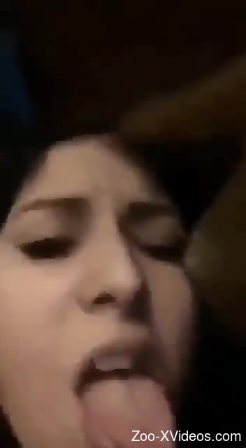 Tight brunette lands entire dog dick into her mouth and pussy