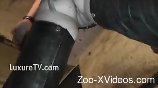 Leather-clad MILF punished by a very hung horse