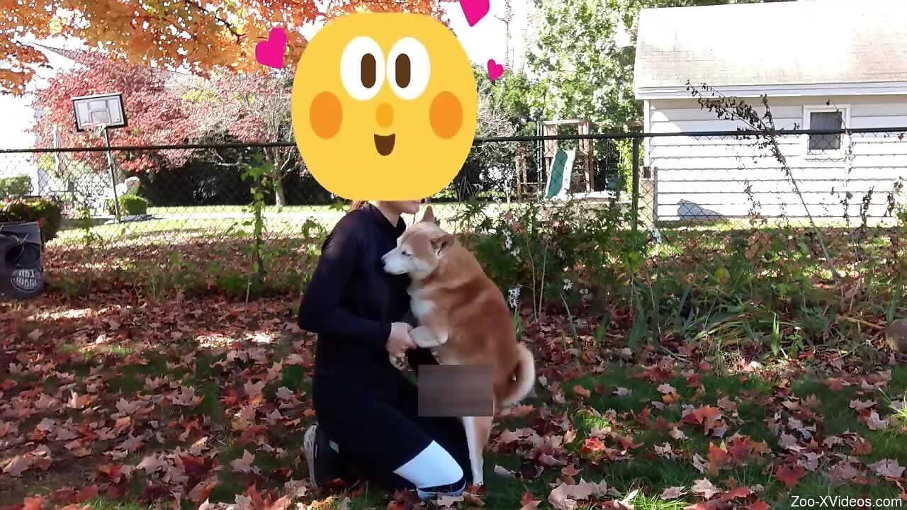 Clothed man gets intimate in the park with his own dog