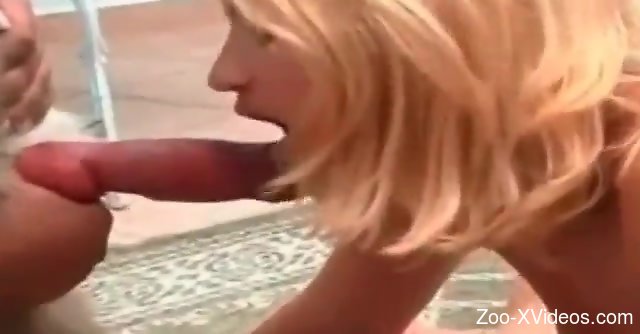 Blonde and brunette fucking the same beast on the floor