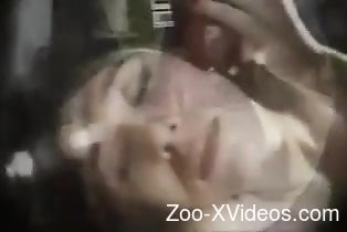 Dark-haired beauty gets face-fucked in a zoo video